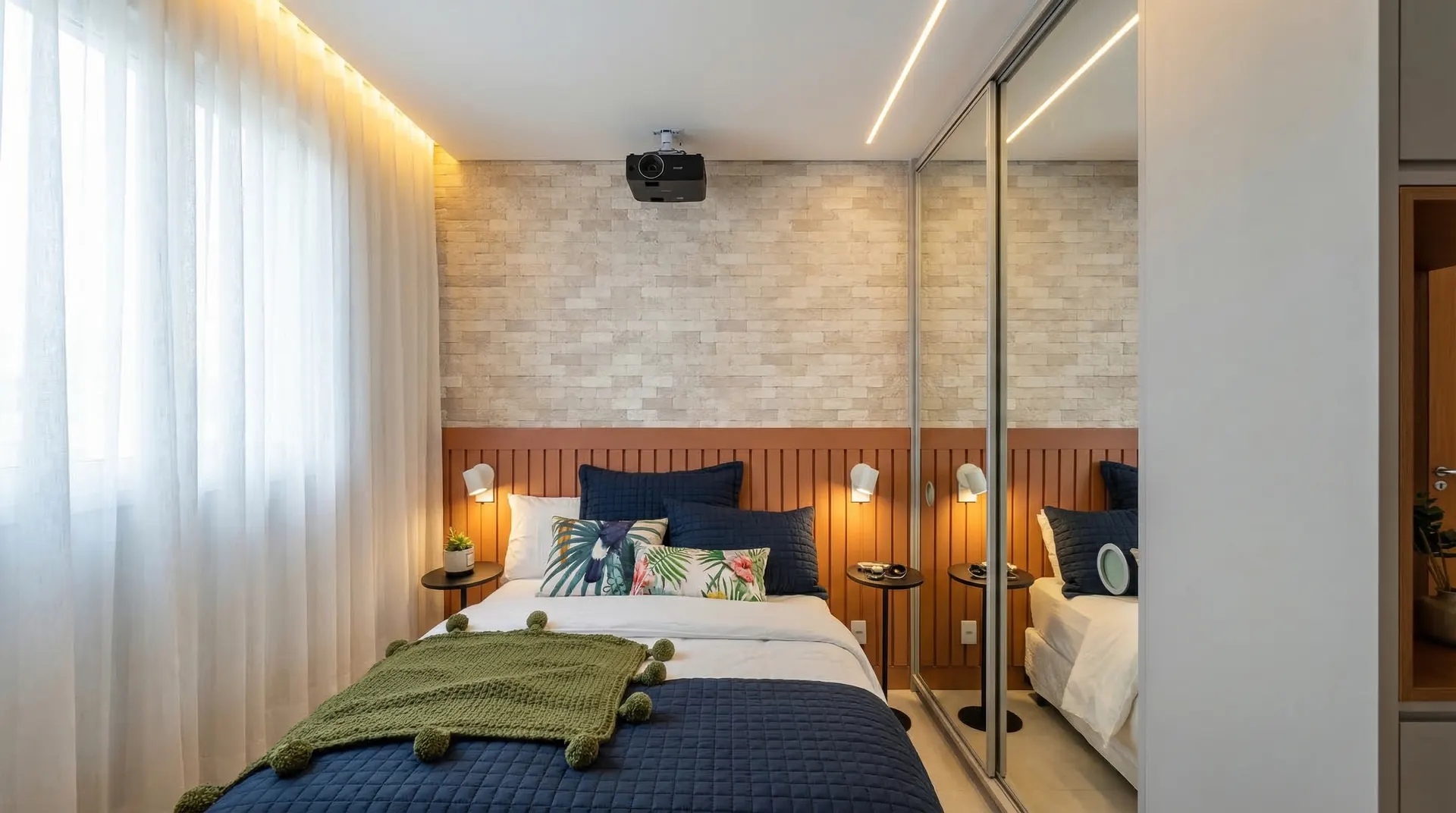 Quarto com almofadas navy e parede em pedra